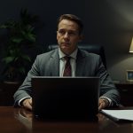 lucid-origin_executive_reviewing_documents_dark_office_cinematic_16_9-7