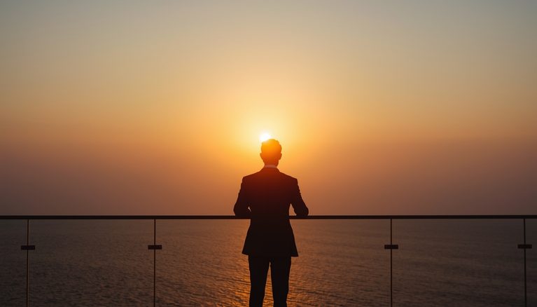 lucid-origin_man_standing_balcony_ocean_horizon_sunrise_suit-7