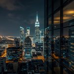 lucid-origin_glass_office_reflection_night_skyline-6